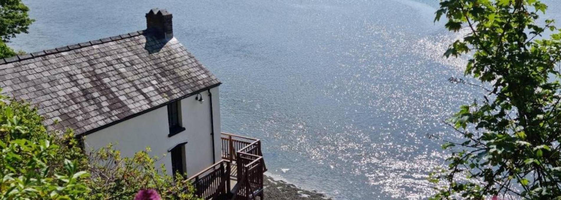 View of the rear of the Boathouse from the Wales Coastal Path above