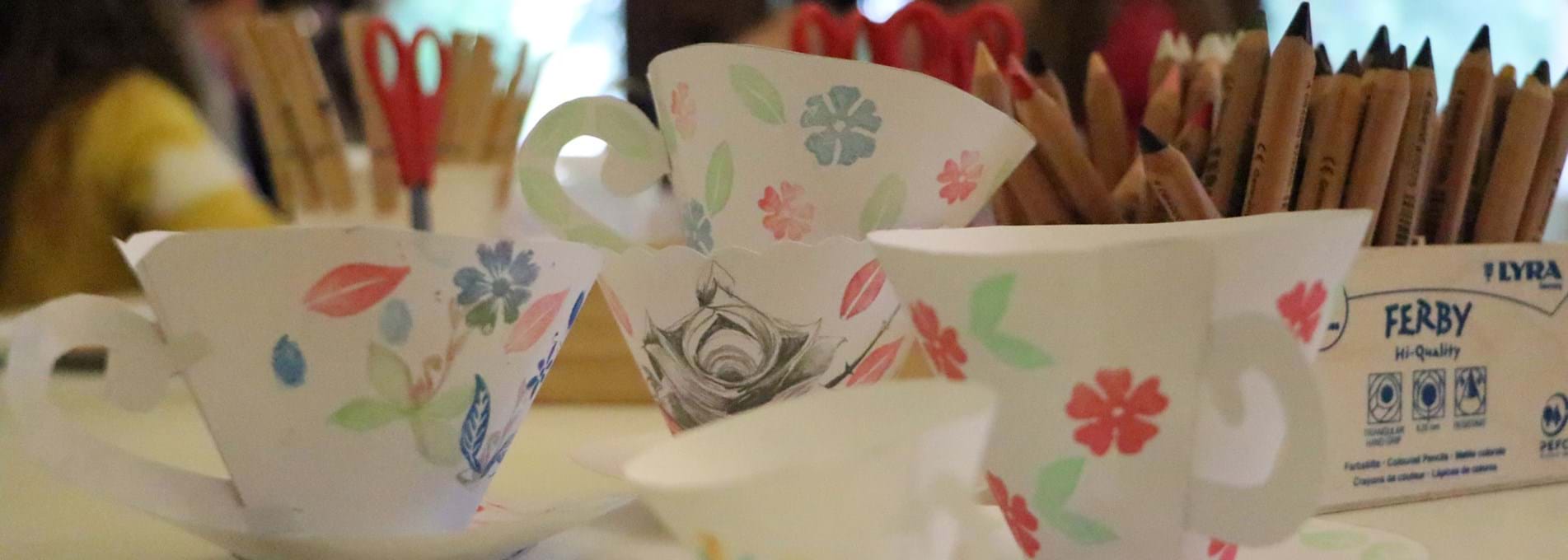 Paper teacups made at a family workshop in Parc Howard and painted to look like pieces of Llanelly Pottery