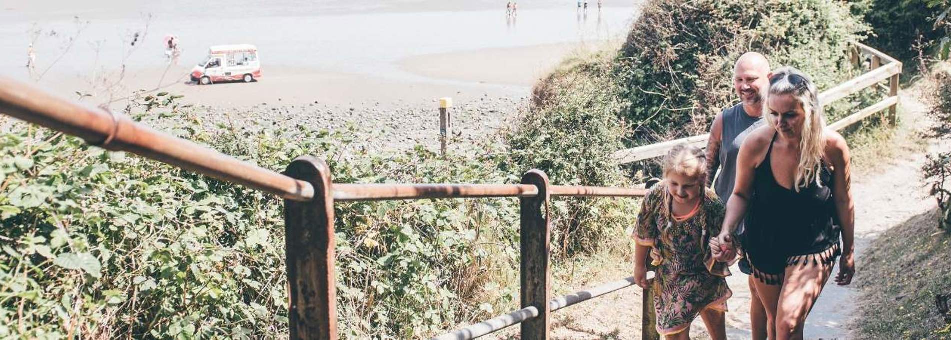Family walking along a cliff path