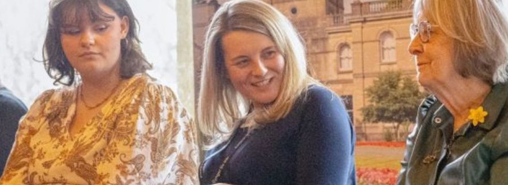A group of women discussing the exhibition